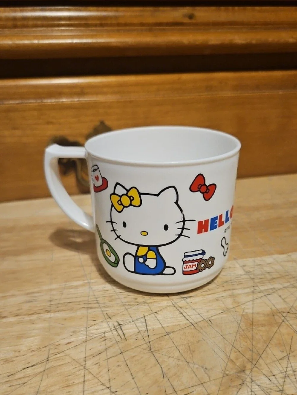 Sanrio Hello Kitty White Kids Cup with Red Bow and Colorful Accents